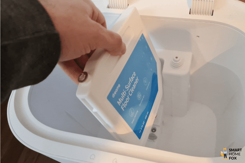 The cleaning agent of the Dreame L10s Ultra is taken out of the base station.